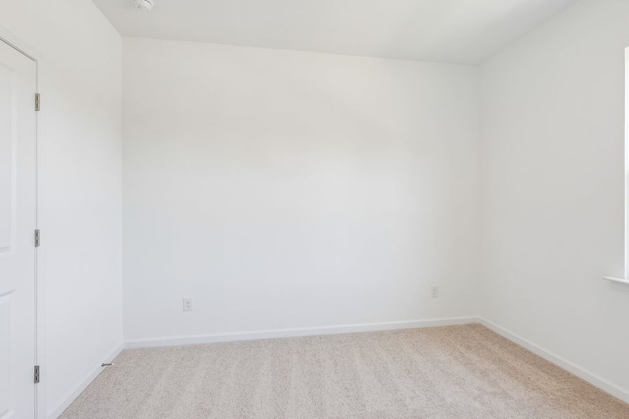 Spacious, unfurnished interior of a new home in Terraces at the Exchange, Indian Land (Image 27).