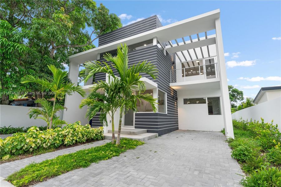 Front exterior of a new home in , Miami, FL, highlighting curb appeal (Image 27).