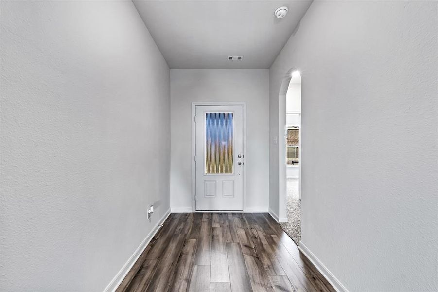 Foyer with dark hardwood / wood-style floors