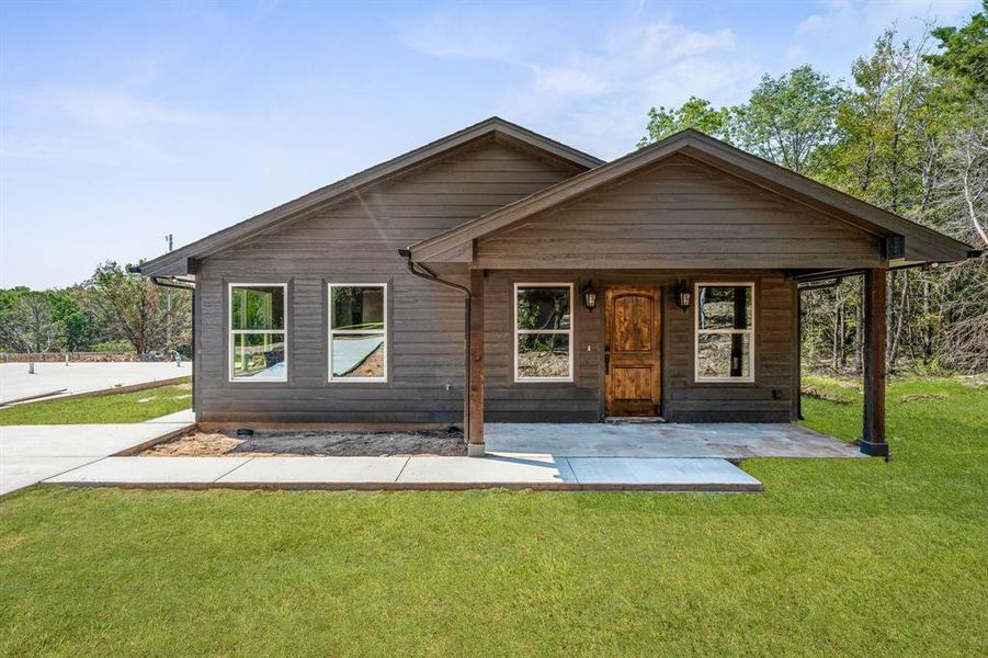 Come home to this perfect curb appeal! Solid wood door gives a rich look to the porch!