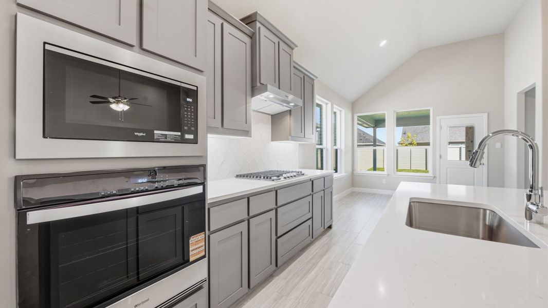Representative furnished interior of a home built from the BASSWOOD by D.R. Horton in Treeline, Justin (Image 17).