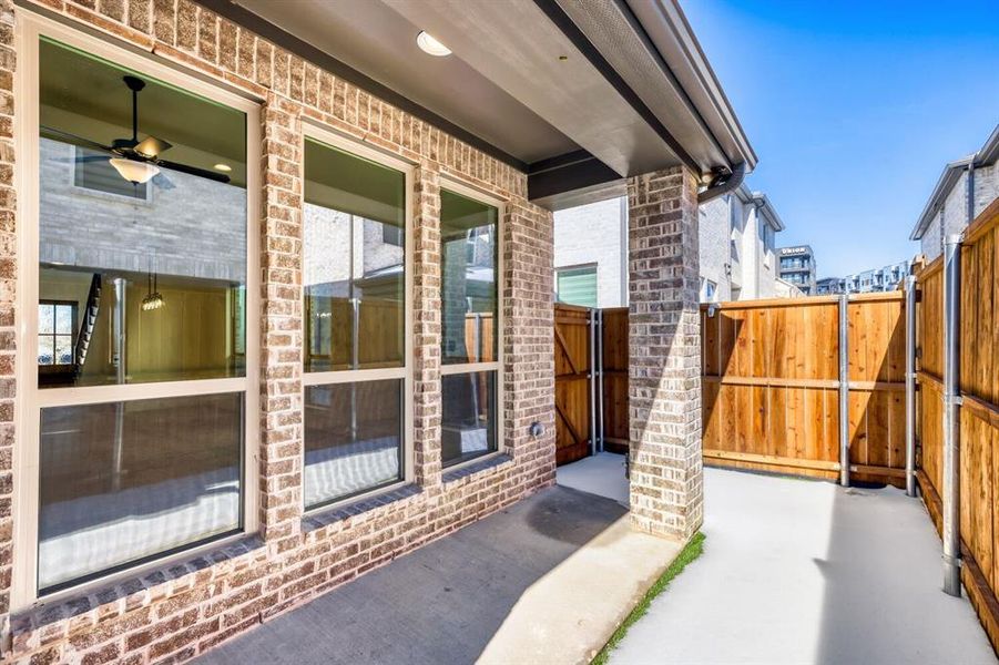 Exterior details and patio area of a home in Castle Hills Northpointe - Townhomes, Lewisville (Image 18).