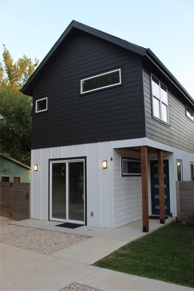 Bold black and white facade creates striking curb appeal.