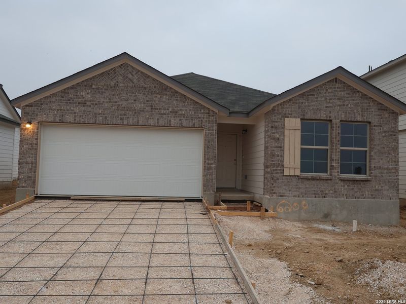 Front exterior of a new home in Mesquite Ridge, San Antonio, TX, highlighting curb appeal (Image 1). Front exterior of a new home in Mesquite Ridge, San Antonio, TX, highlighting curb appeal (Image 1).