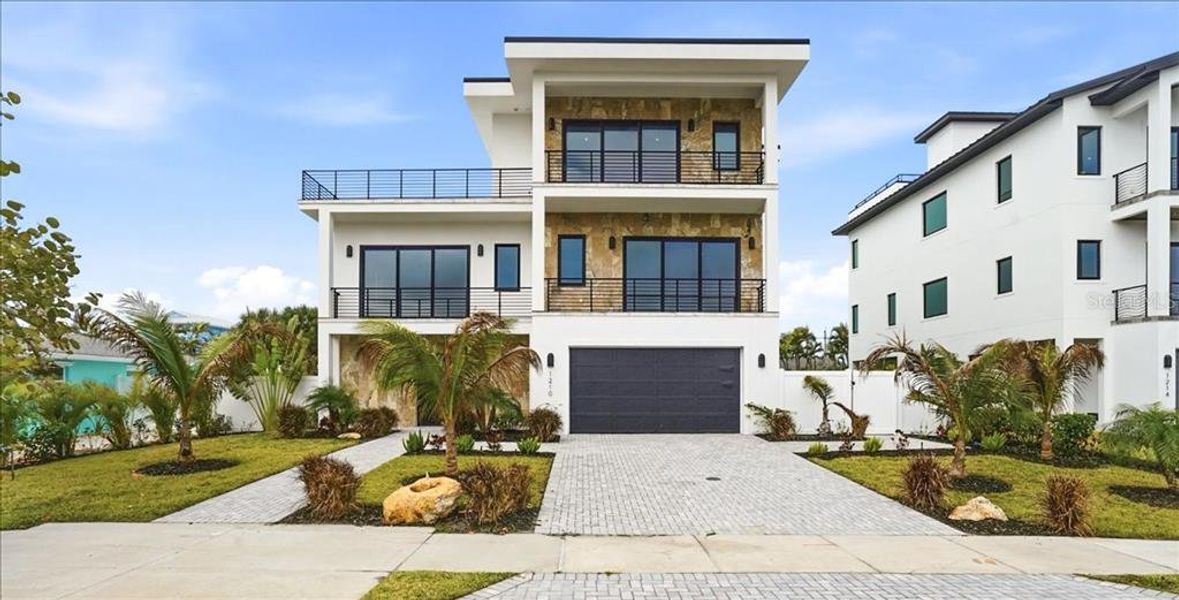 Front exterior of a new home in , Englewood, FL, highlighting curb appeal (Image 27).