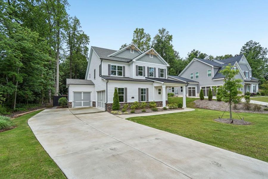 Front exterior of a new home in Arden on Lanier, Cumming, GA, highlighting curb appeal (Image 22).