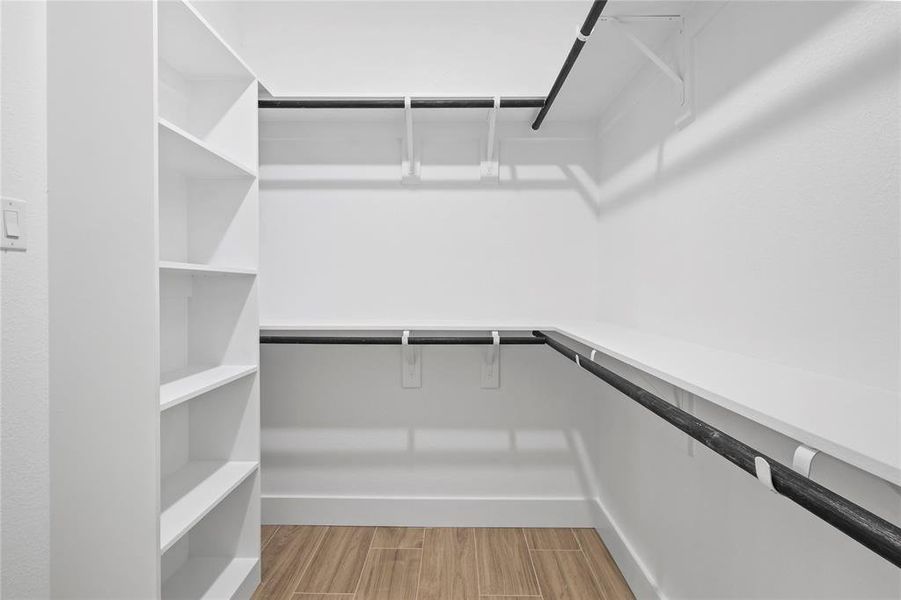 Spacious closet featuring wood finish floors Spacious closet featuring wood finish floors