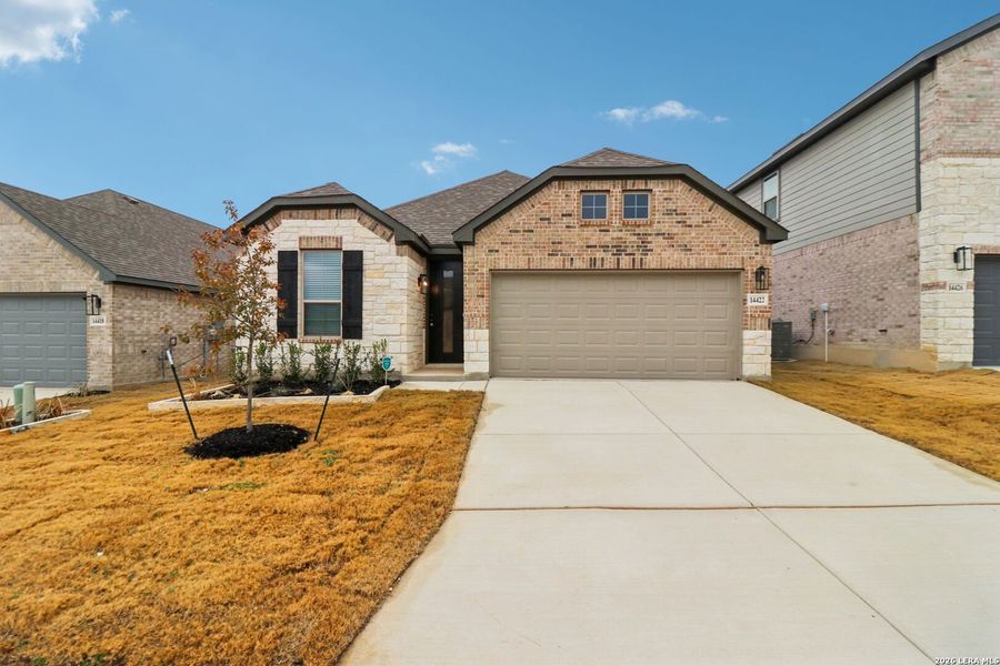 Front exterior of a new home in Kallison Ranch, San Antonio, TX, highlighting curb appeal (Image 18).