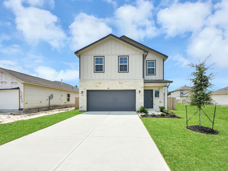 Front exterior of a new home in The Villages at WestPointe, Dayton, TX, highlighting curb appeal (Image 22).