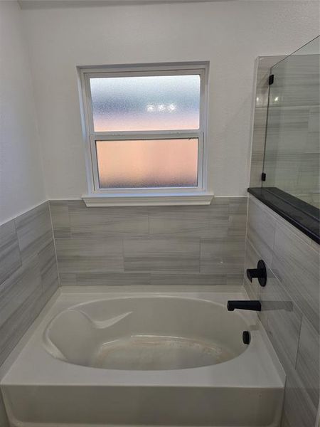 Bathroom featuring plus walk in shower