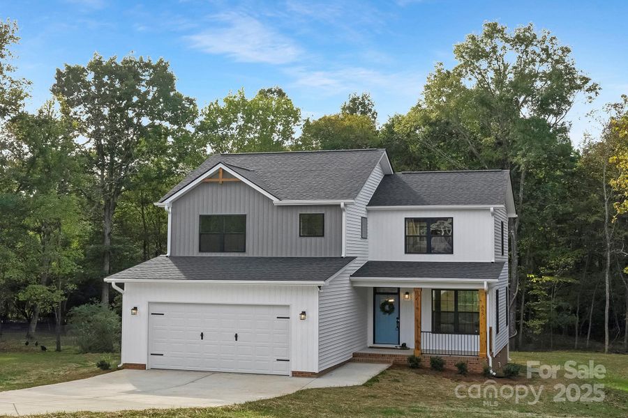 Front exterior of a new home in , Stanley, NC, highlighting curb appeal (Image 25).