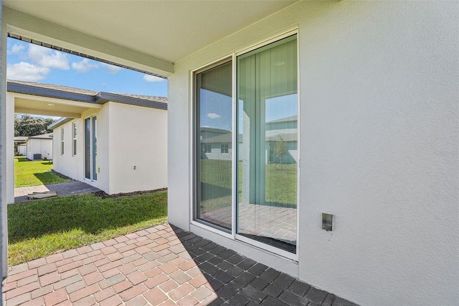 Exterior details and patio area of a home in The Reserve at Twin Lakes, St. Cloud (Image 29).