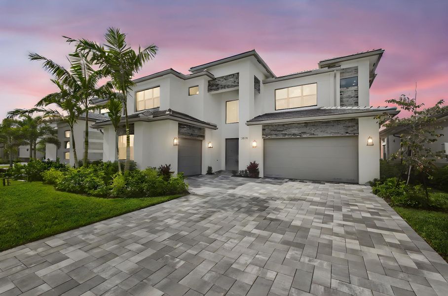 Front exterior of a new home in Apex at Avenir, Palm Beach Gardens, FL, highlighting curb appeal (Image 2).