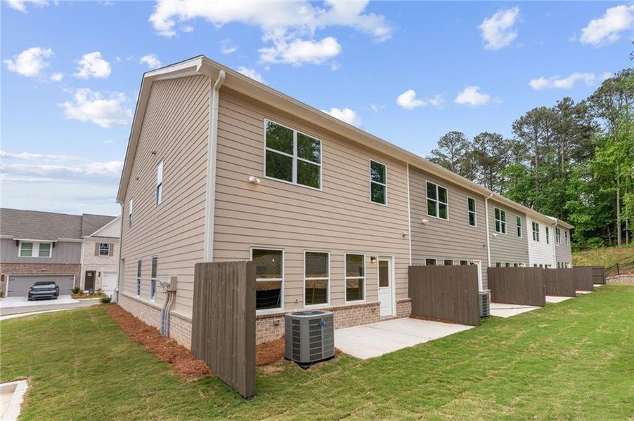 Exterior details and patio area of a home in River Walk Place, Lawrenceville (Image 18).