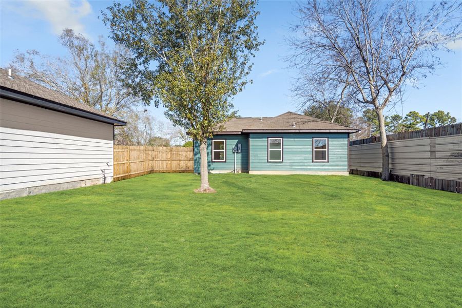 Expansive, level yard with privacy fencing—ideal for pets or play.
