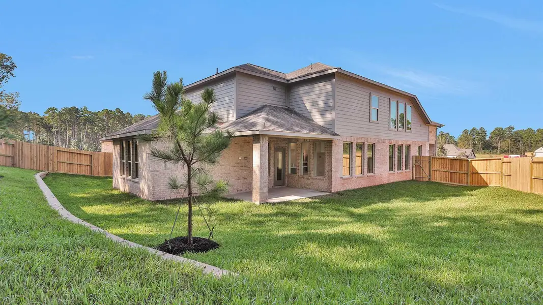 Exterior details and patio area of a home in The Woodlands Hills 40', Willis (Image 3).