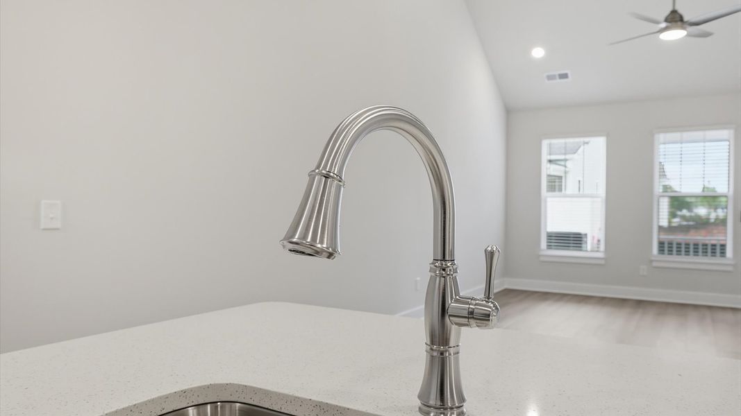 Exclusive kitchen design with a center island, quartz countertops, and tasteful finishes throughout in Anderson, SC