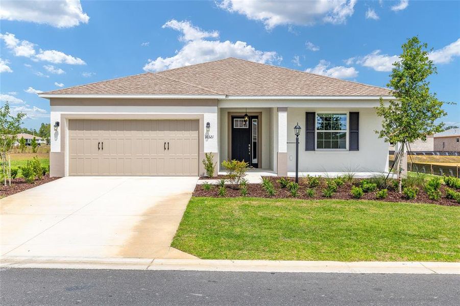 Front exterior of a new home in , Ocala, FL, highlighting curb appeal (Image 2). Front exterior of a new home in , Ocala, FL, highlighting curb appeal (Image 2).