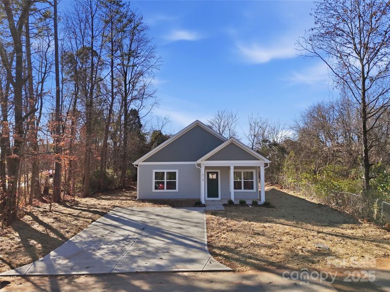 Front exterior of a new home in , East Spencer, NC, highlighting curb appeal (Image 23).
