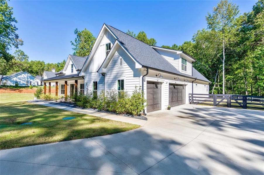 Front exterior of a new home in , Woodstock, GA, highlighting curb appeal (Image 21).