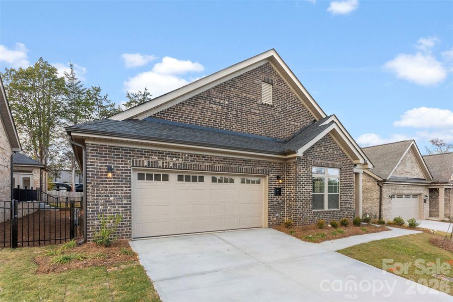 Front exterior of a new home in The Courtyards on New Hope, Gastonia, NC, highlighting curb appeal (Image 2). Front exterior of a new home in The Courtyards on New Hope, Gastonia, NC, highlighting curb appeal (Image 2).