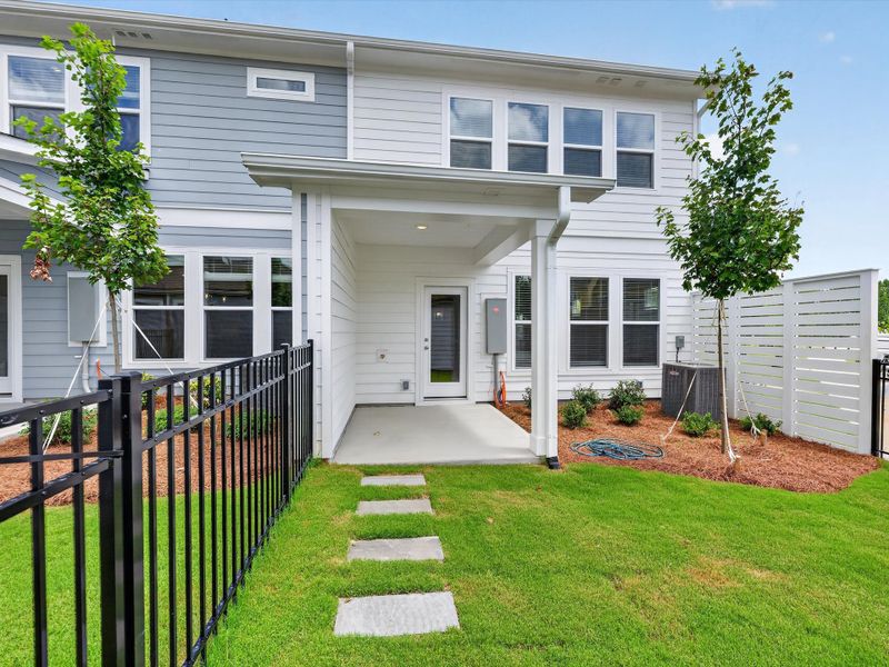 Exterior details and patio area of a home in North Creek Village - Townhomes, Huntersville (Image 24).