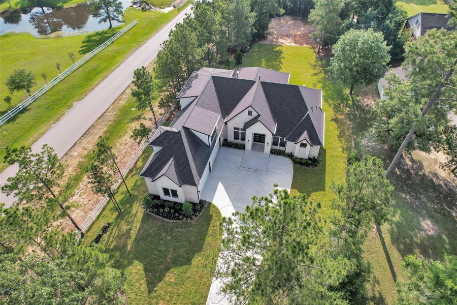 Front exterior of a new home in , Montgomery, TX, highlighting curb appeal (Image 26). Front exterior of a new home in , Montgomery, TX, highlighting curb appeal (Image 26).