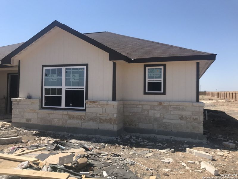 Front exterior of a new home in , Moore, TX, highlighting curb appeal (Image 1).