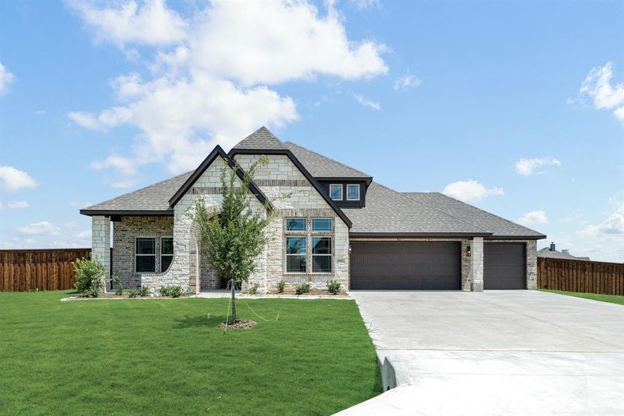Front exterior of a new home in Wildcat Ridge Phase 2 and 4, Godley, TX, highlighting curb appeal (Image 1). Front exterior of a new home in Wildcat Ridge Phase 2 and 4, Godley, TX, highlighting curb appeal (Image 1).
