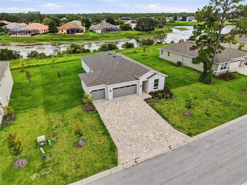 Front exterior of a new home in Glen Lakes, Weeki Wachee, FL, highlighting curb appeal (Image 19).