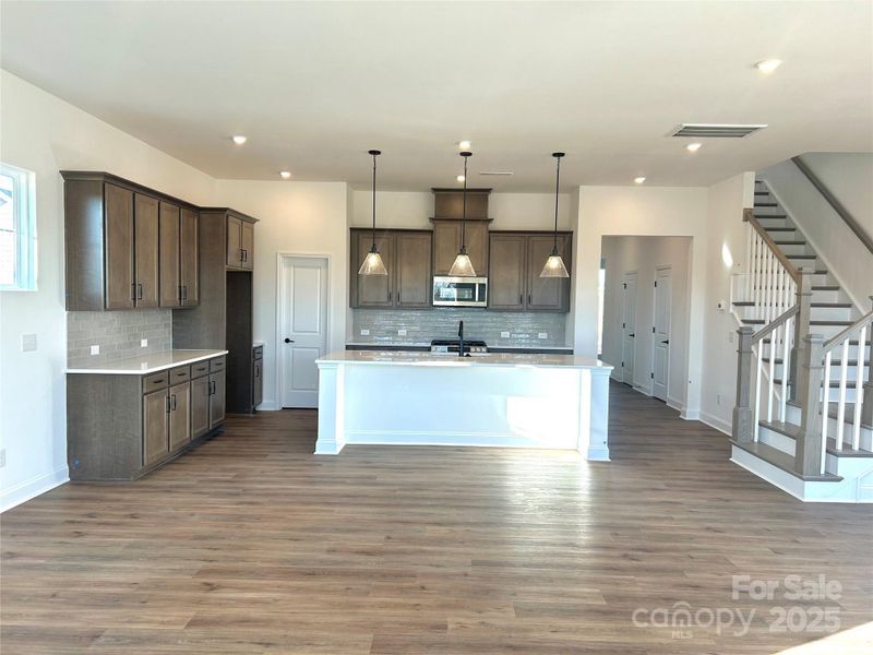 Welcome home! Spacious family room and open floorplan concept. Guest suite with en suite bath and walk in closet + powder room on main level. Welcome home! Spacious family room and open floorplan concept. Guest suite with en suite bath and walk in closet + powder room on main level.