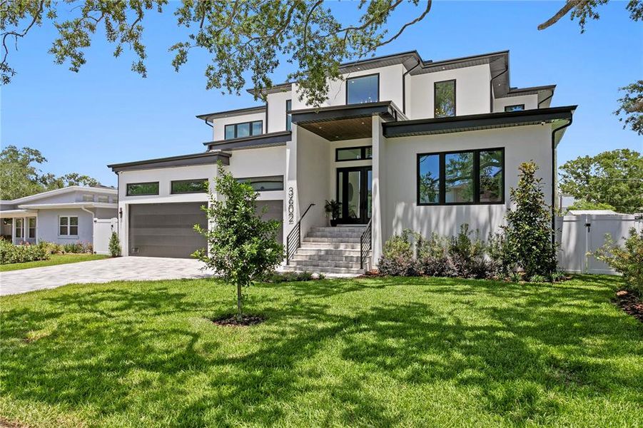 Front exterior of a new home in , Tampa, FL, highlighting curb appeal (Image 30). Front exterior of a new home in , Tampa, FL, highlighting curb appeal (Image 30).