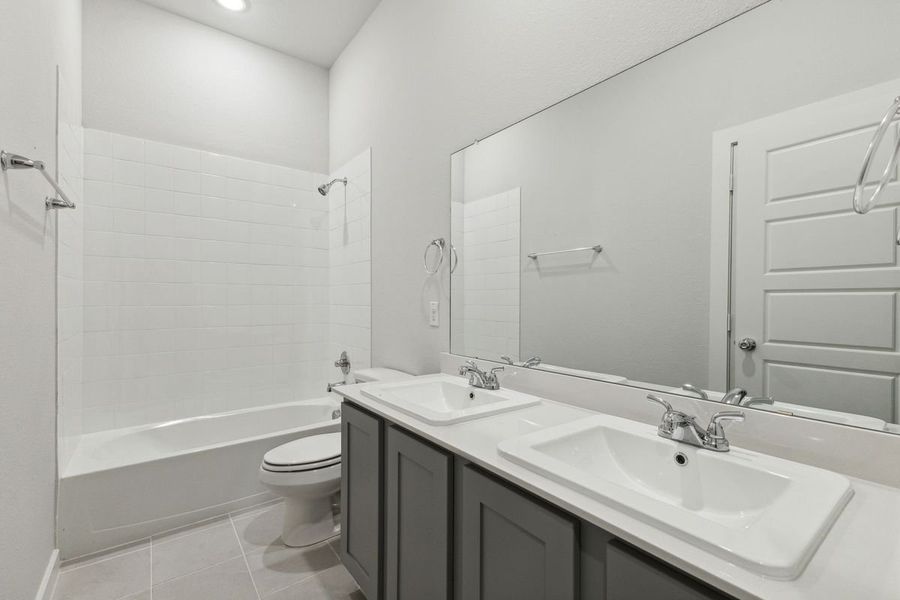 Bathroom in the Quartz home plan by Trophy Signature Homes – REPRESENTATIVE PHOTO