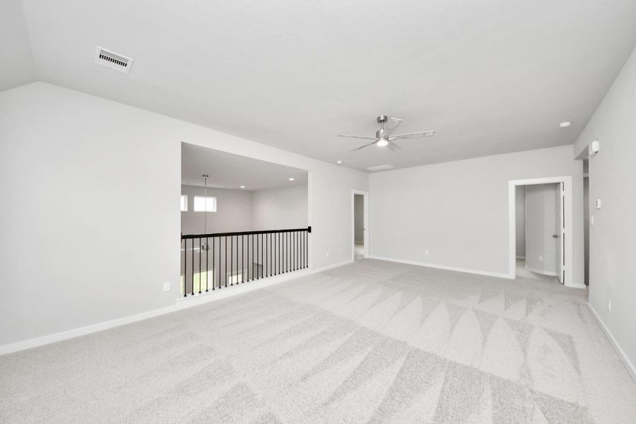 Ascend to relaxation in this fantastic game room! Ideal for both casual gatherings and adult gaming, it boasts plush carpet, lofty ceilings, custom paint, and ample windows for abundant natural light. Sample photo of completed home with similar floor plan. Actual colors and selections may vary. Ascend to relaxation in this fantastic game room! Ideal for both casual gatherings and adult gaming, it boasts plush carpet, lofty ceilings, custom paint, and ample windows for abundant natural light. Sample photo of completed home with similar floor plan. Actual colors and selections may vary.