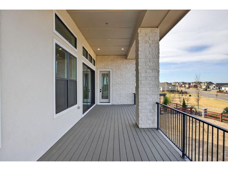 Exterior details and patio area of a home in RainDance, Windsor (Image 26).