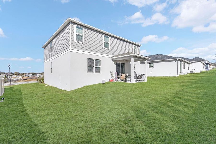 Exterior details and patio area of a home in The Reserve at Lake Ridge, Minneola (Image 24).
