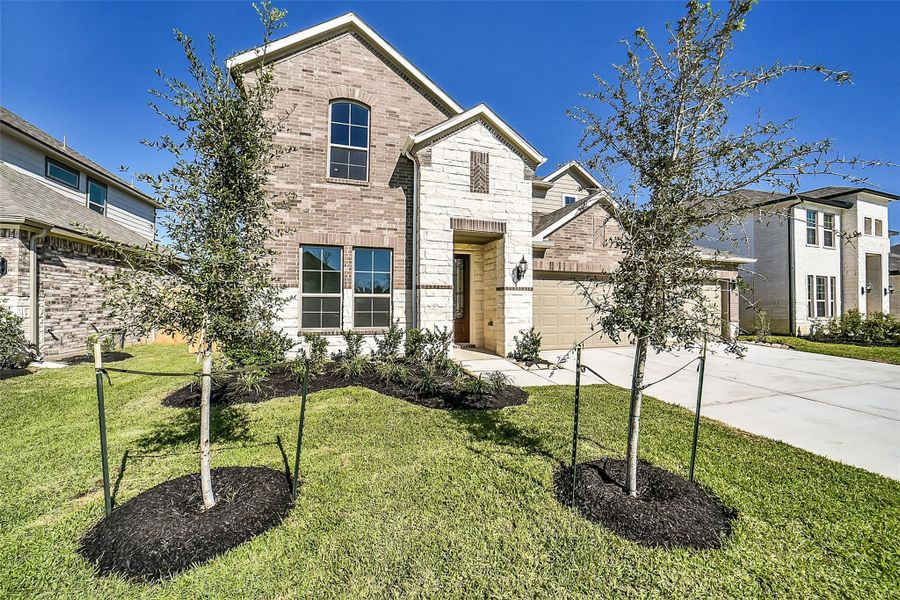 Front exterior of a new home in Stone Creek Ranch, Hockley, TX, highlighting curb appeal (Image 2). Front exterior of a new home in Stone Creek Ranch, Hockley, TX, highlighting curb appeal (Image 2).