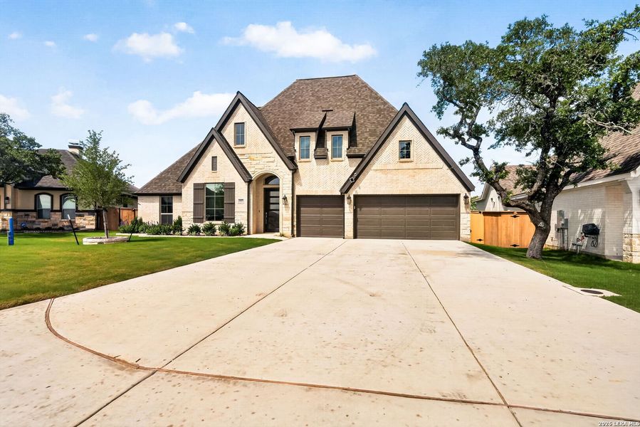 Front exterior of a new home in , Bulverde, TX, highlighting curb appeal (Image 24).