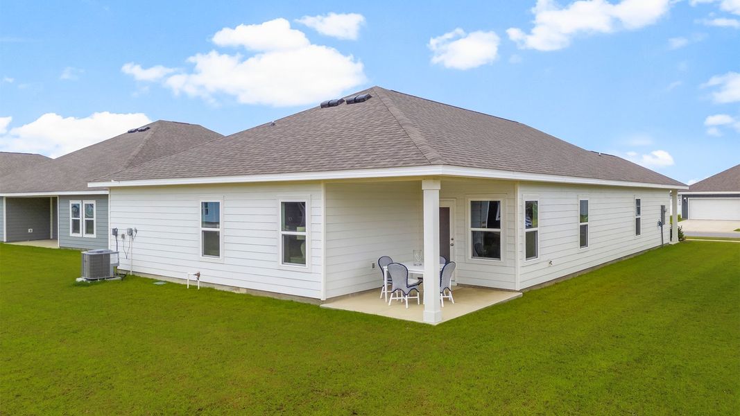 Front exterior of a new home in Liberty, Panama City, FL, highlighting curb appeal (Image 21). Front exterior of a new home in Liberty, Panama City, FL, highlighting curb appeal (Image 21).