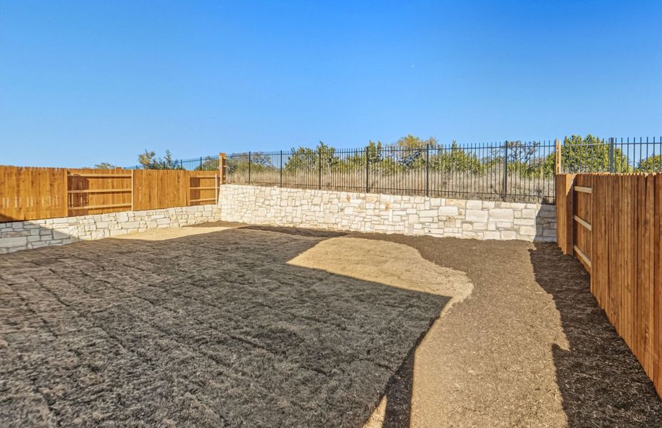 Exterior details and patio area of a home in West Cypress Hills, Spicewood (Image 27).