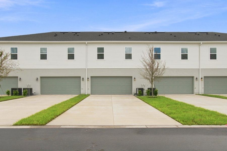 Front exterior of a new home in Palmeras at Crossprairie – The Palms Collection, St. Cloud, FL, highlighting curb appeal (Image 1). Front exterior of a new home in Palmeras at Crossprairie – The Palms Collection, St. Cloud, FL, highlighting curb appeal (Image 1).