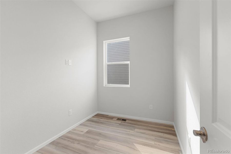 Spacious, unfurnished interior of a new home in The Manors Collection at Golden Overlook, Lakewood (Image 17).