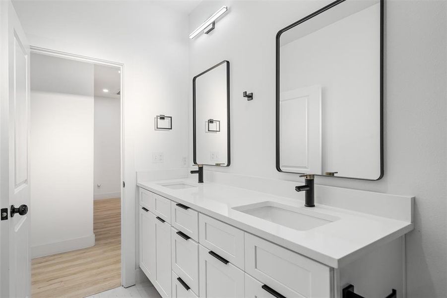 Bathroom with vanity and hardwood / wood-style floors