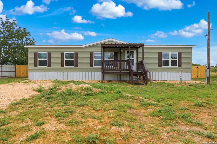 Exterior details and patio area of a home in , Atascosa (Image 13).