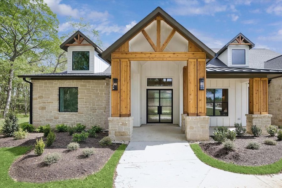 Front exterior of a new home in , Plantersville, TX, highlighting curb appeal (Image 26).