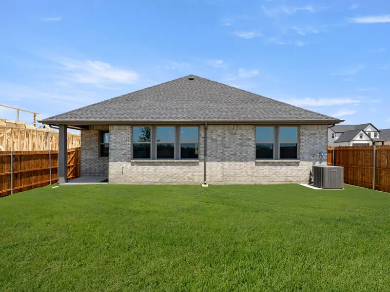 Exterior details and patio area of a home in Mercer Meadows, Royse City (Image 4).