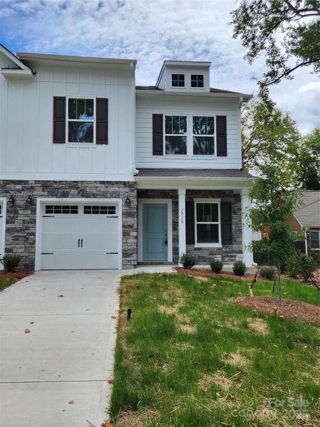 Front exterior of a new home in , Charlotte, NC, highlighting curb appeal (Image 1).
