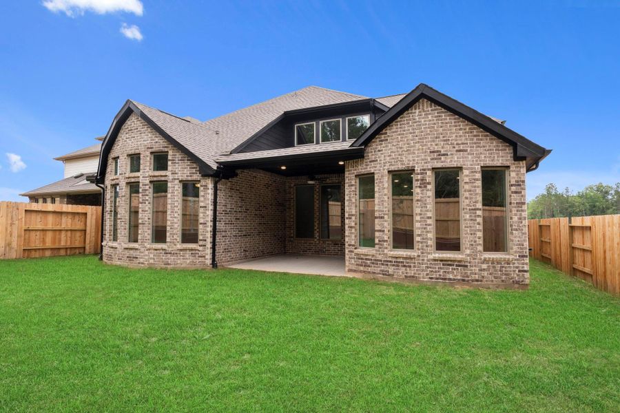 Exterior details and patio area of a home in Wildtree, Magnolia (Image 22).