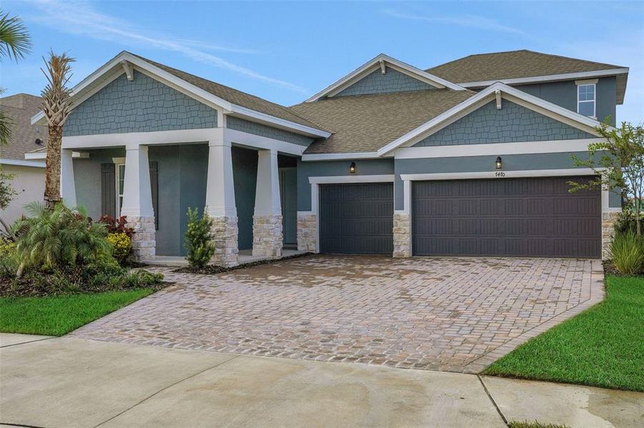Front exterior of a new home in Seaire, Parrish, FL, highlighting curb appeal (Image 22).
