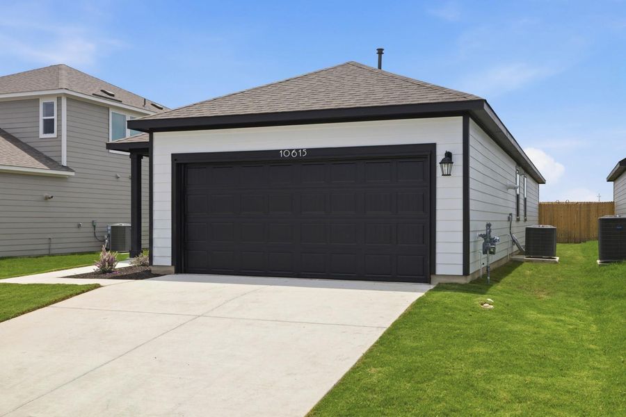 Front exterior of a new home in Stallion Run, Buda, TX, highlighting curb appeal (Image 23).